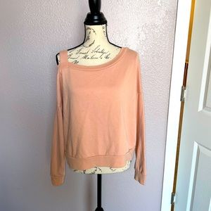FOREVER21 peach colored sweatshirt w/cold-shoulder on right shoulder.